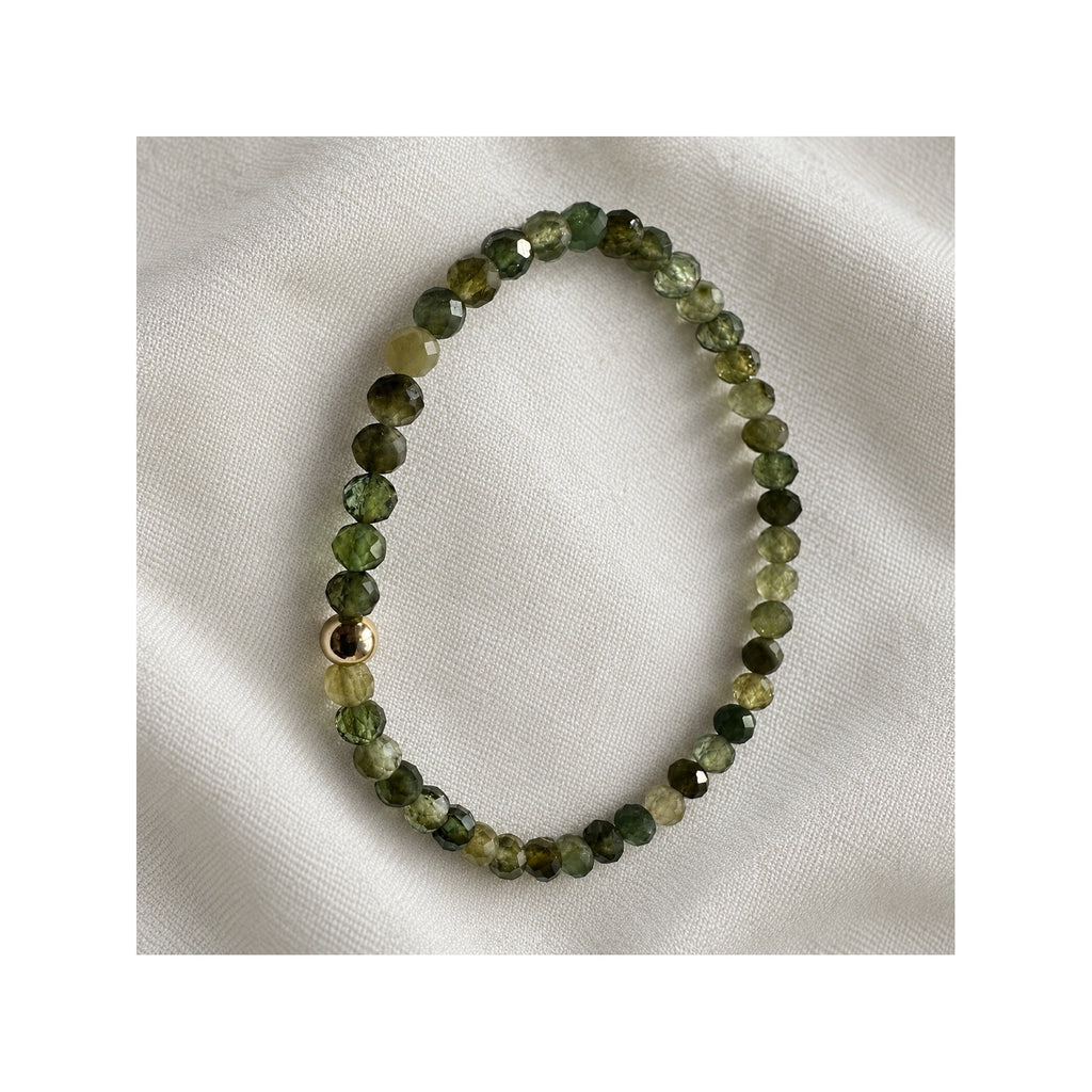 Close-up of FOREST GREENS green tourmaline bracelet and its natural moss and olive gemstone colours