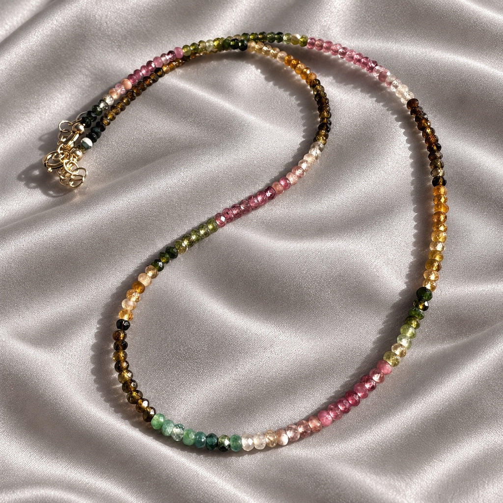Full AFTER HOURS necklace showing the colour sequence of 3 mm tourmaline rondelles and gold-filled clasp on silk
