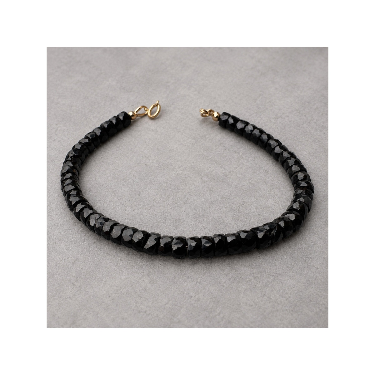BLACK SERPENT bracelet with irregular faceted black spinel rondelles
